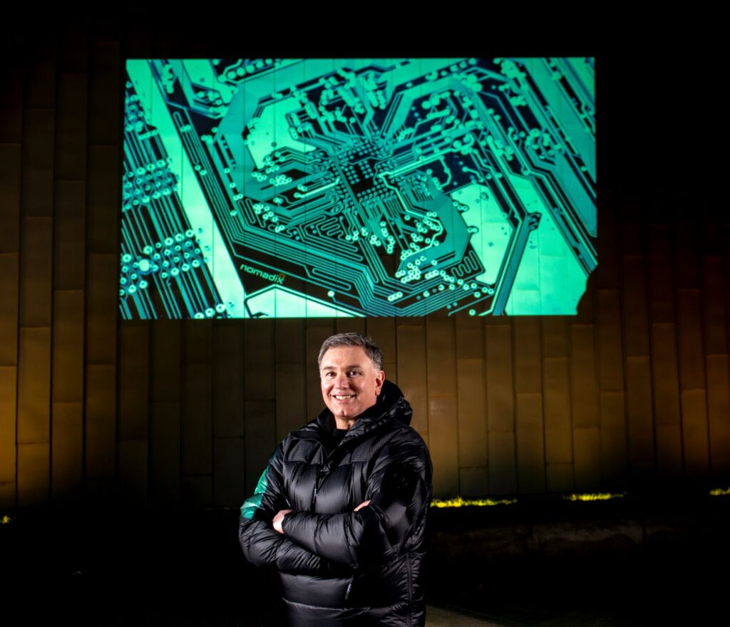 Mark Evans in front of projection.