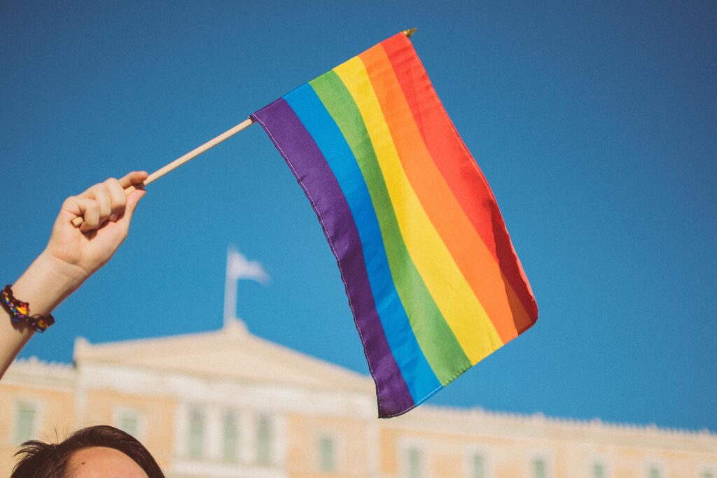 LGBTQ+ flag waving.