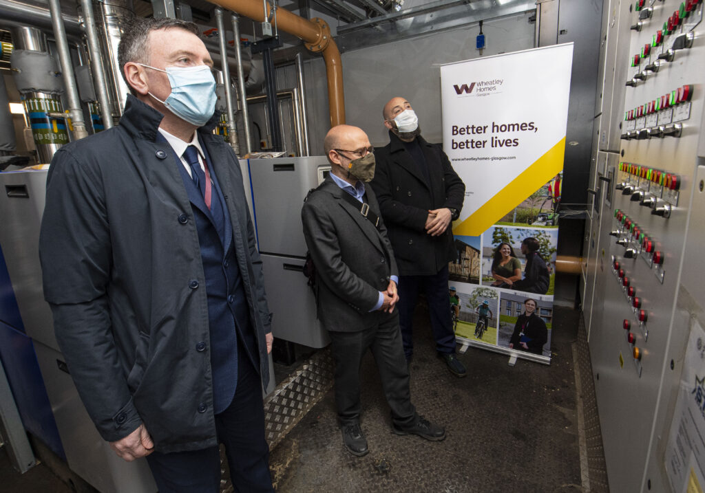 Patrick Harvie MSP, centre, with Wheatley Group Director of Repairs and Assets Frank McCafferty, left, and Wheatley’s Sustainability Manager Colin Reid.
