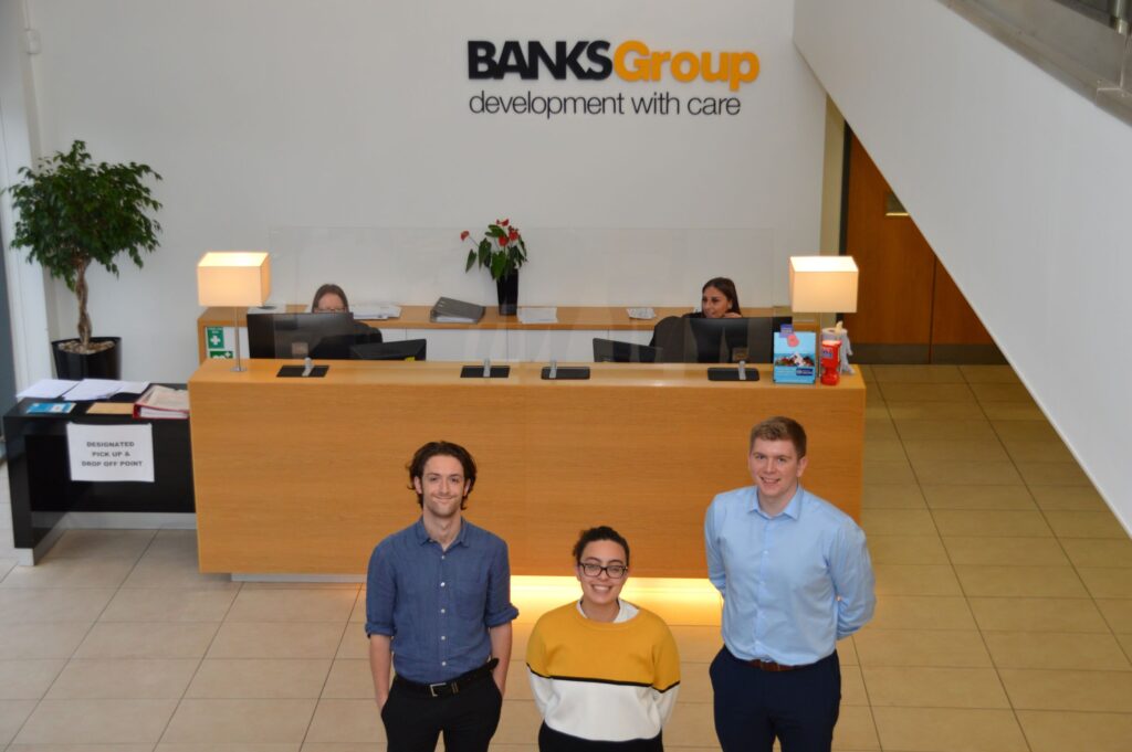 Pic of Michael Newton, Nour Matarid and James Robson in Banks reception.
