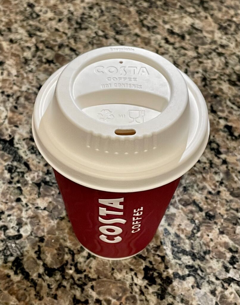 Costa cup with new lid on top.