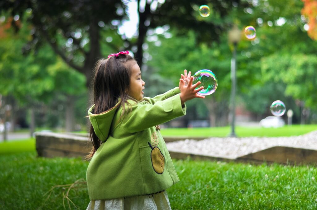 Young girl playing outside.