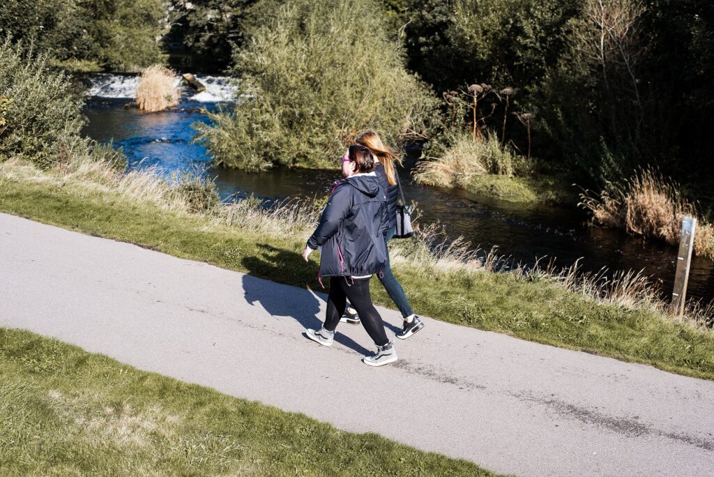 Two members of the public walking.