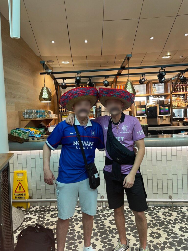 The disruptive fan posed for a picture at Manchester Airport