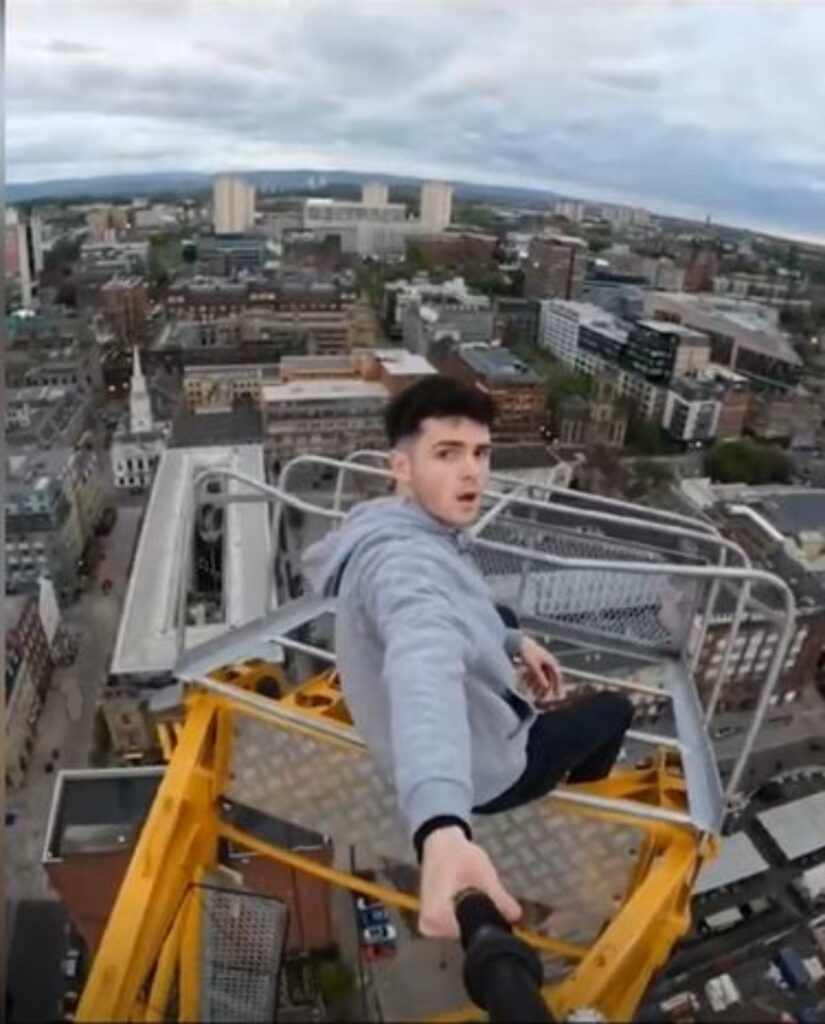 He carried on to the top and filmed himself despite seeing the police on their way.