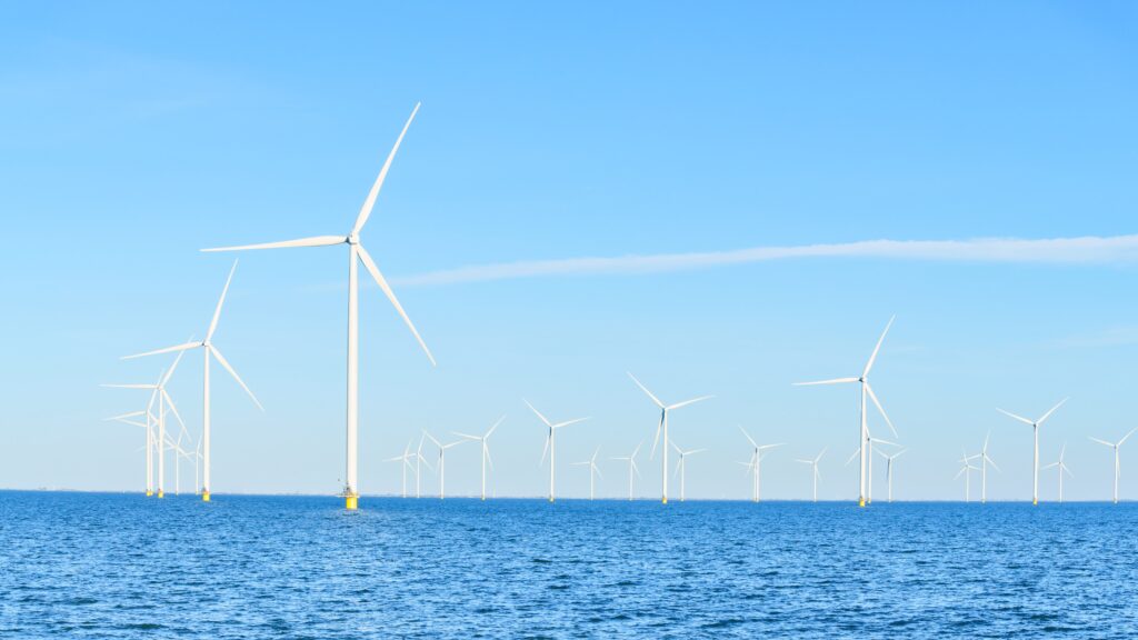 Landscape of wind turbines at sea.