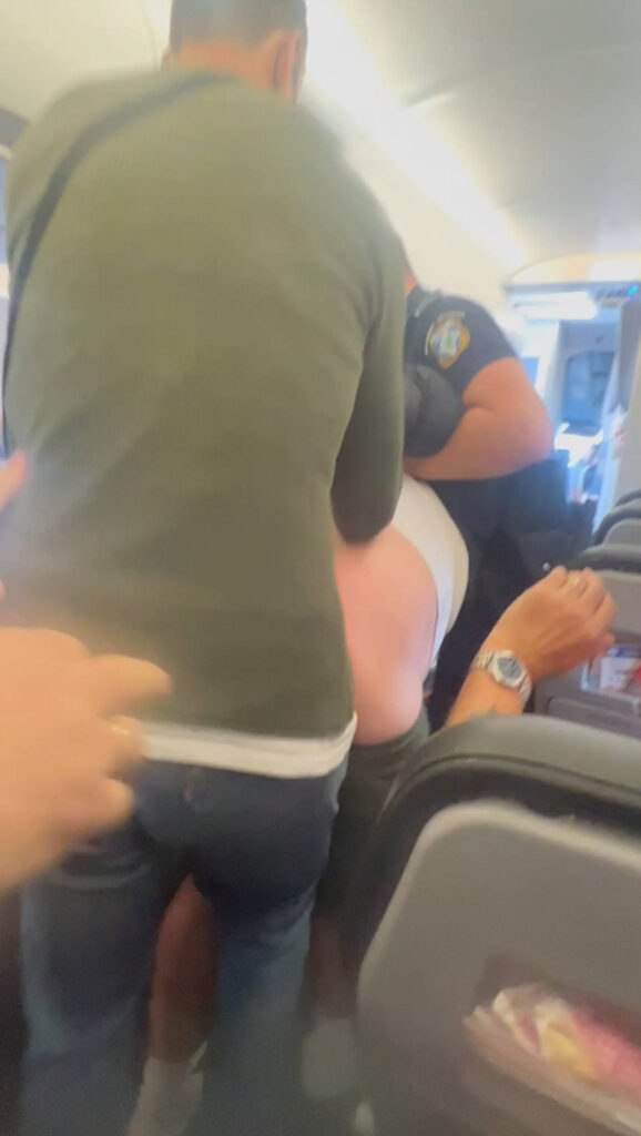 Greek police dragging Jet2 passenger 