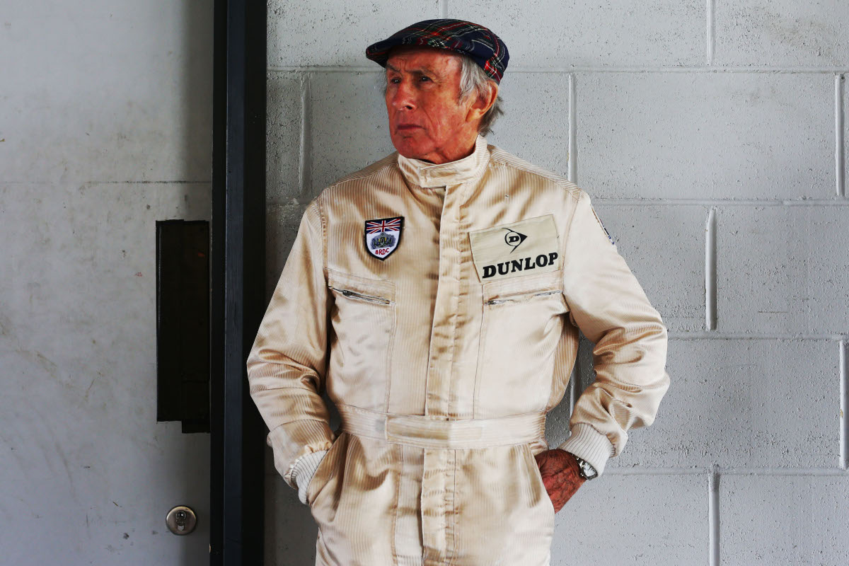 Jackie Stewart in his race suit.