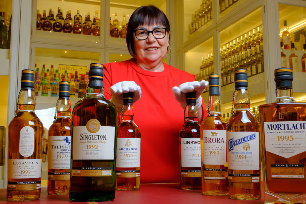 Master Blender Maureen Robinson pictured with various bottles of Scotch whisky.