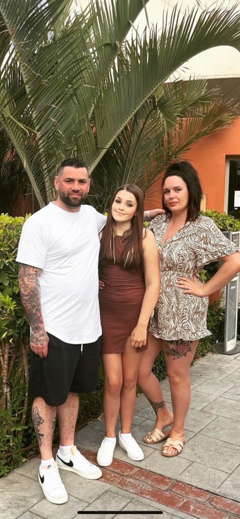 Imogen with her parents on a family holiday