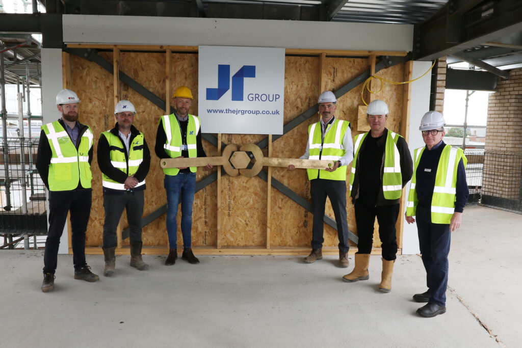 Chris Carroll of TCS Construction Consultants, David Howe, Assistant Site Manager at JR Group, Councillor Martin Kilbride, , David Glennon, Project Manager of Ayrshire Housing, Gordon Fleming of ARPL Architects and Jim Whiston, Director of Ayrshire Housing.
