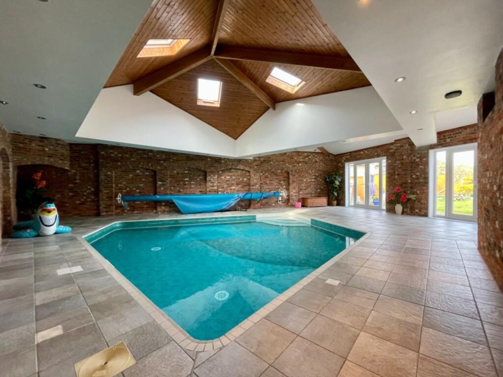 The pool sits below the skylight