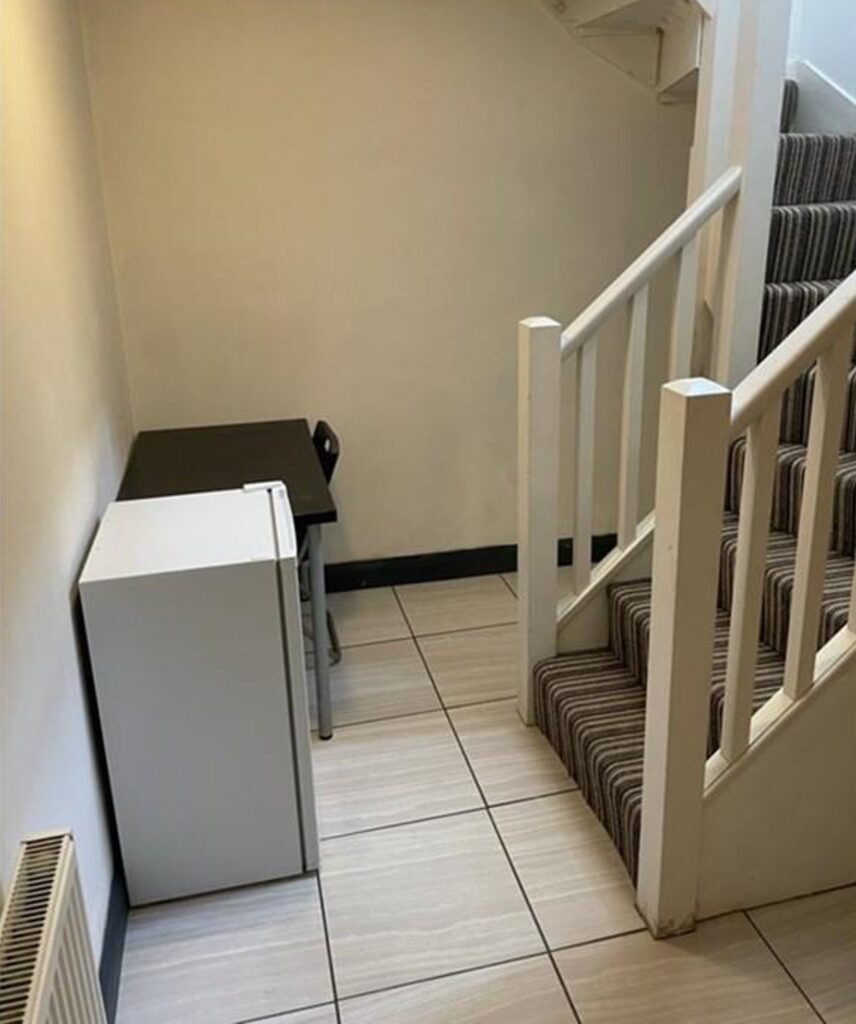 The fridge at the bottom of the stairs