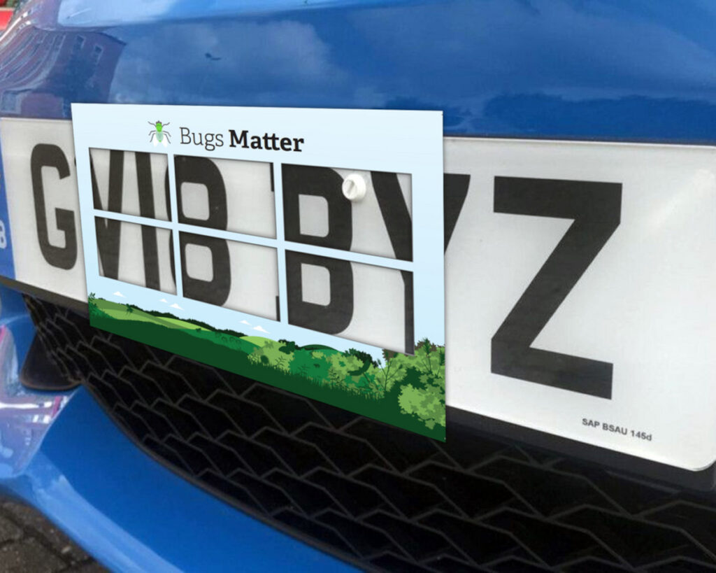 A numberplate with the Splatometer attached to the front.