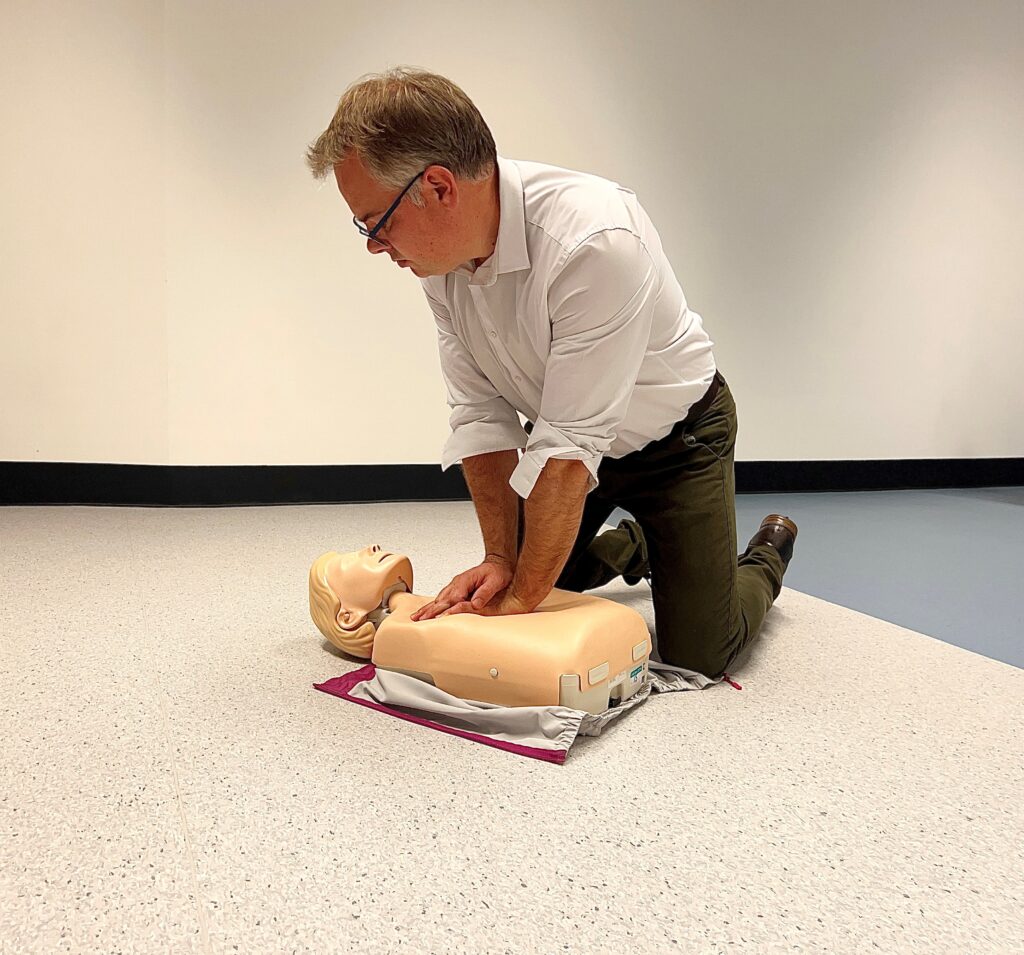 Dr Kevin Stirling from the University of Dundee's School of Health and Sciences pictured demonstrating CPR on a teaching manikin.