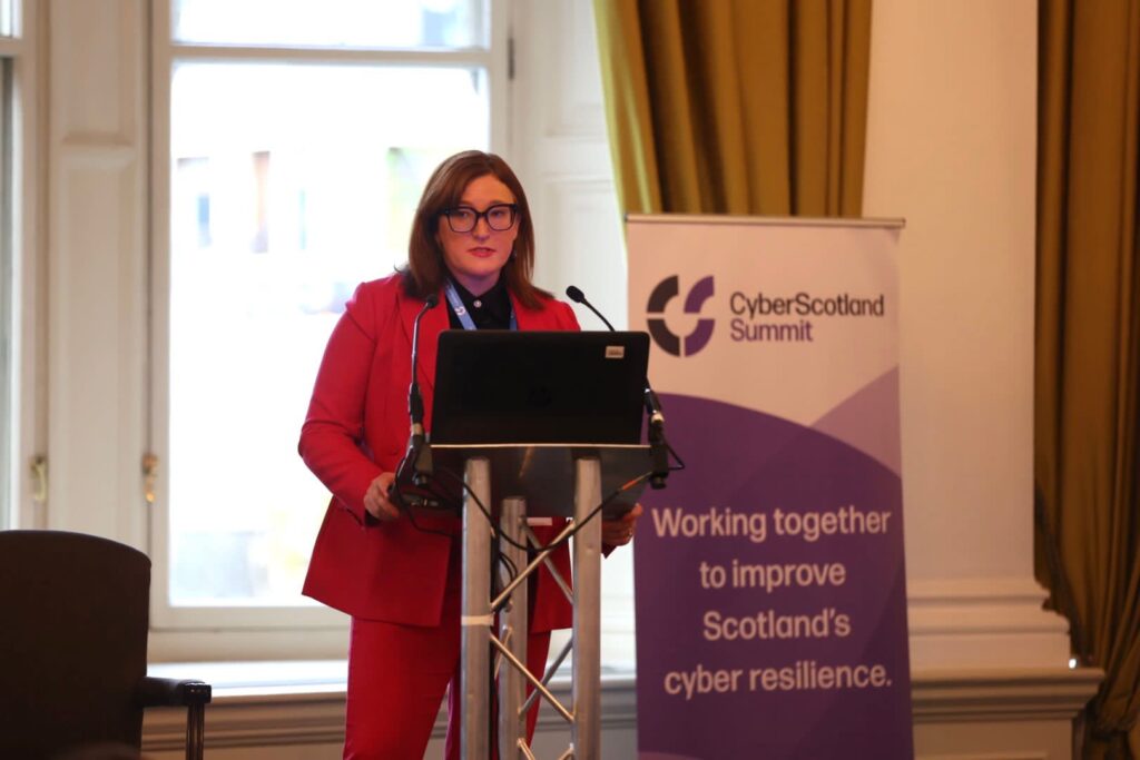 Jude McCorry, Chair of the CyberScotland Partnership addresses delegates at the CyberScotland Summit. Image supplied with release.