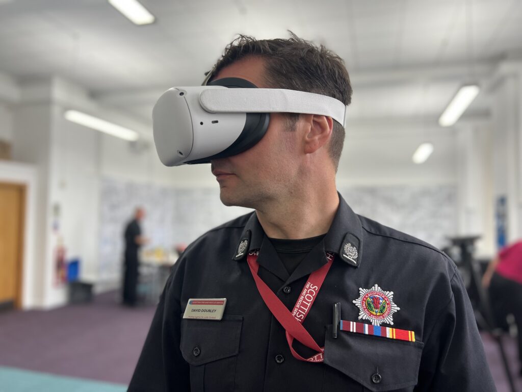 A Scottish Fire and Rescue Service member using VR technology. image supplied with release.