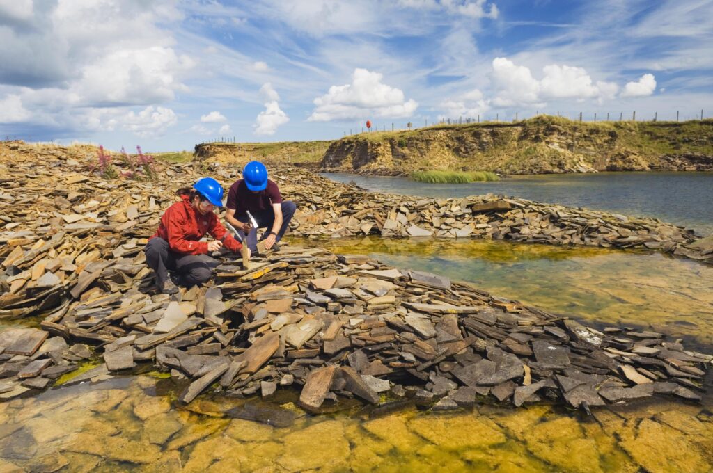 Geologists carrying out geological research at Achanarras Quarry SSSI.