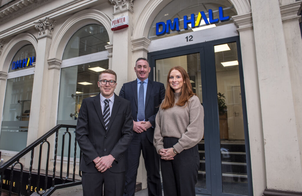 DM Hall's newest members (L-R) Ross Craig, Gary Brown and Lisa Cummings standing in front of the firm's Glasgow office.
