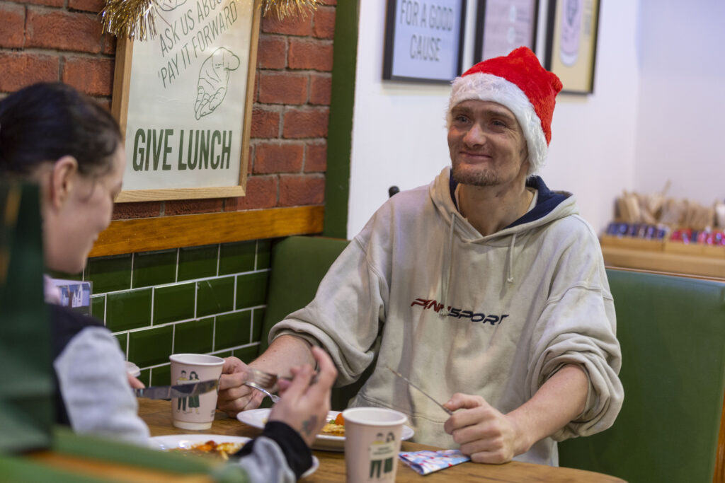 Man enjoying a meal as part of the Social Bite campaign.