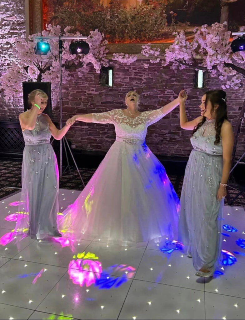 Dee dancing with her bridesmaids.