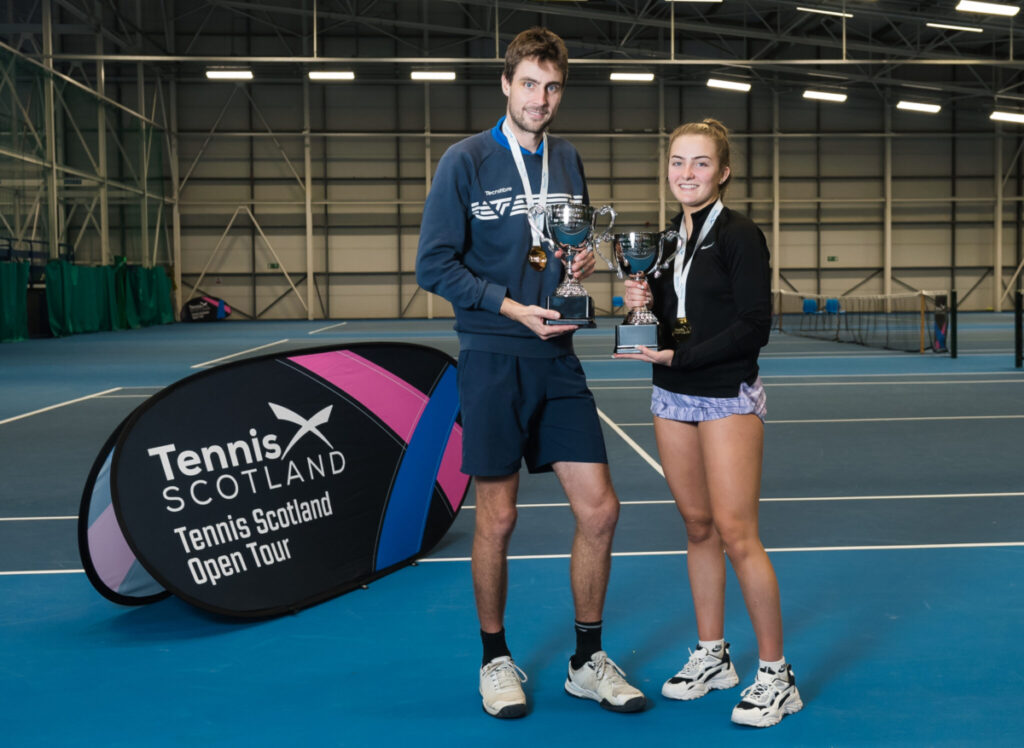 Nicolas Rosenzweig and Phoebe Mitchell holding their trophies