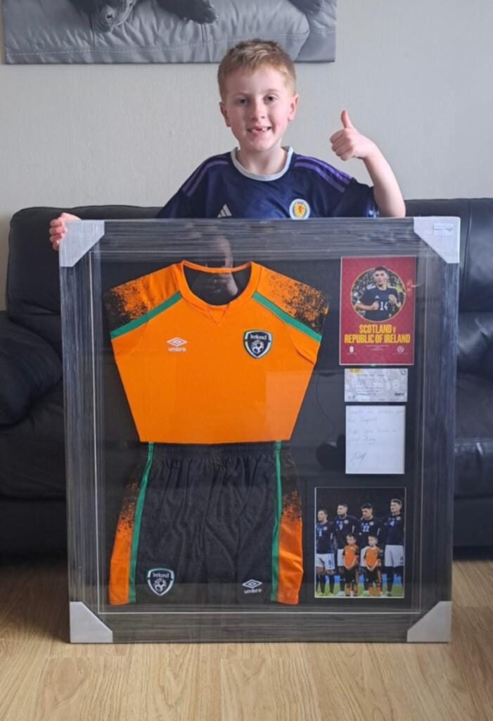Rory Edwards with his framed mascot kit and note from Hickey.
