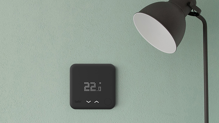 Smart thermostat in black, close-up.