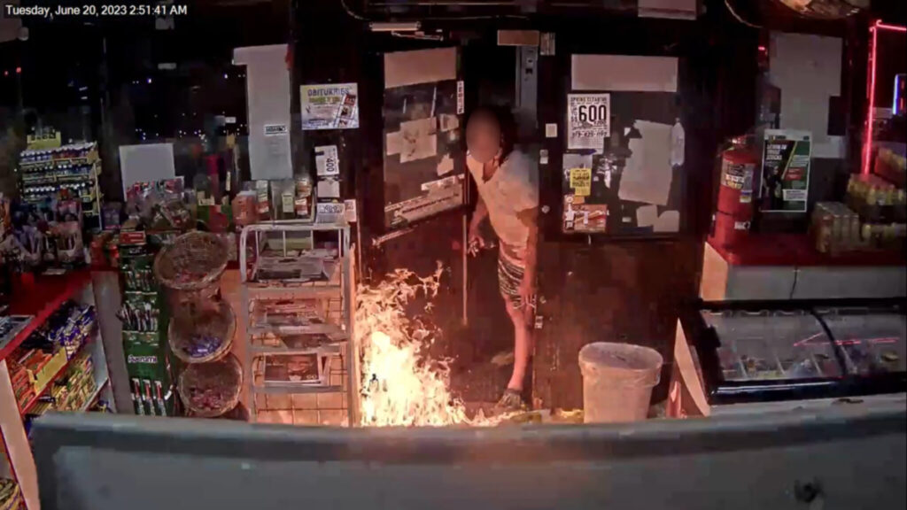 Suspect setting fire to the Sunoco petrol station in Detroit, in the US State of Michigan on 20th June.