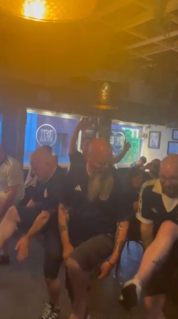 The Tartan Army in an Oslo pub performing the slosh