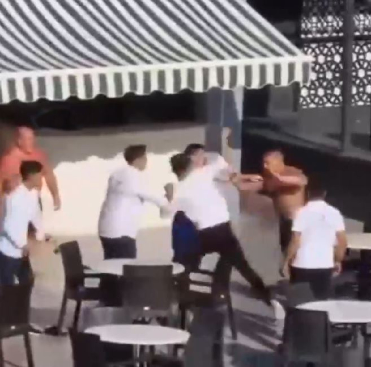 Some of the alleged staff landing punches on the man.