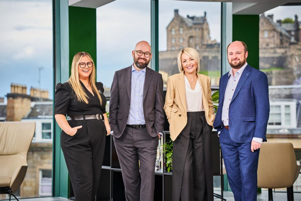 Newly appointed partners Louise Chambers, Stephen Farrell, Karen Manning and Liam Young standing in Burness Paull Edinburgh office