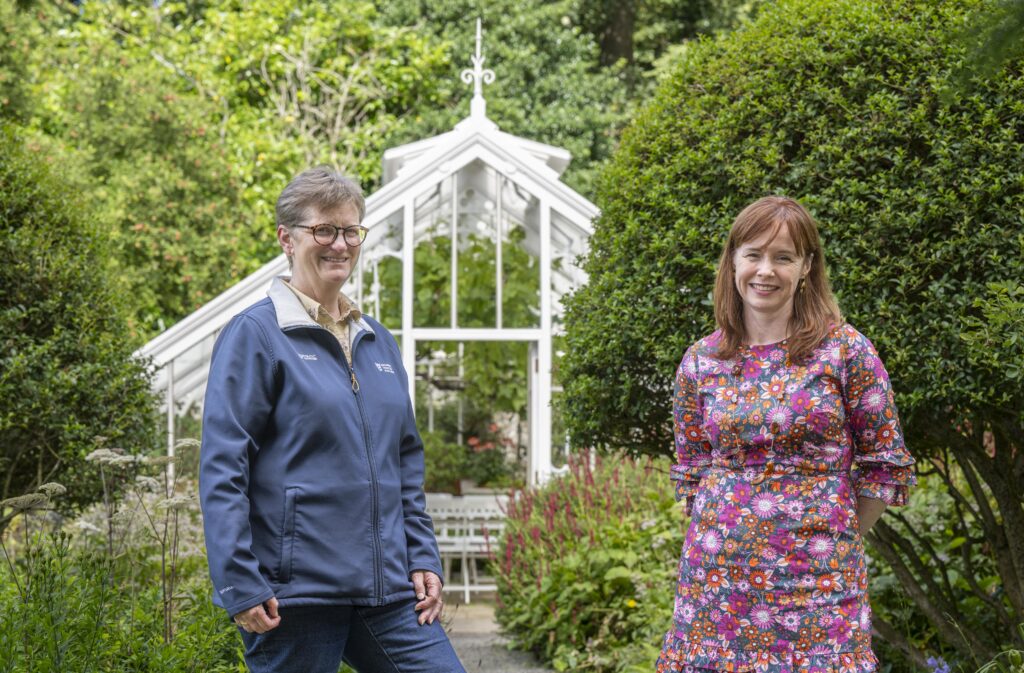 Malleny Garden, Balerno, Edinburgh. L-R Sarah MacKinnon, Head of Buildings, National Trust for Scotland and Susan OÕConnor, Head of Grants, Historic Environment Scotland with the restored glasshouse behind.