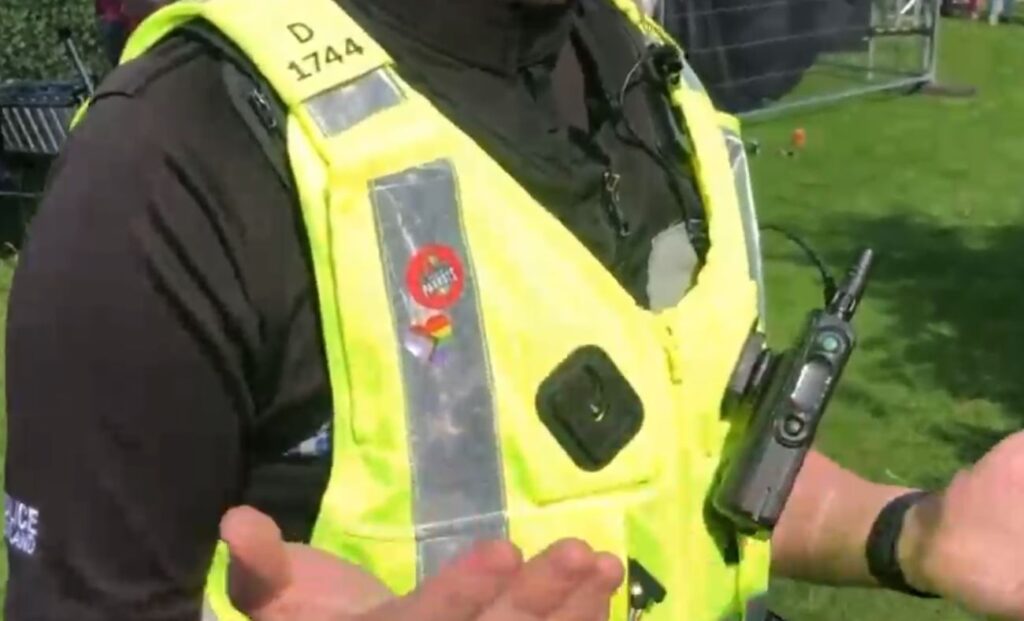 Police officer high vis vest with trans badge attached