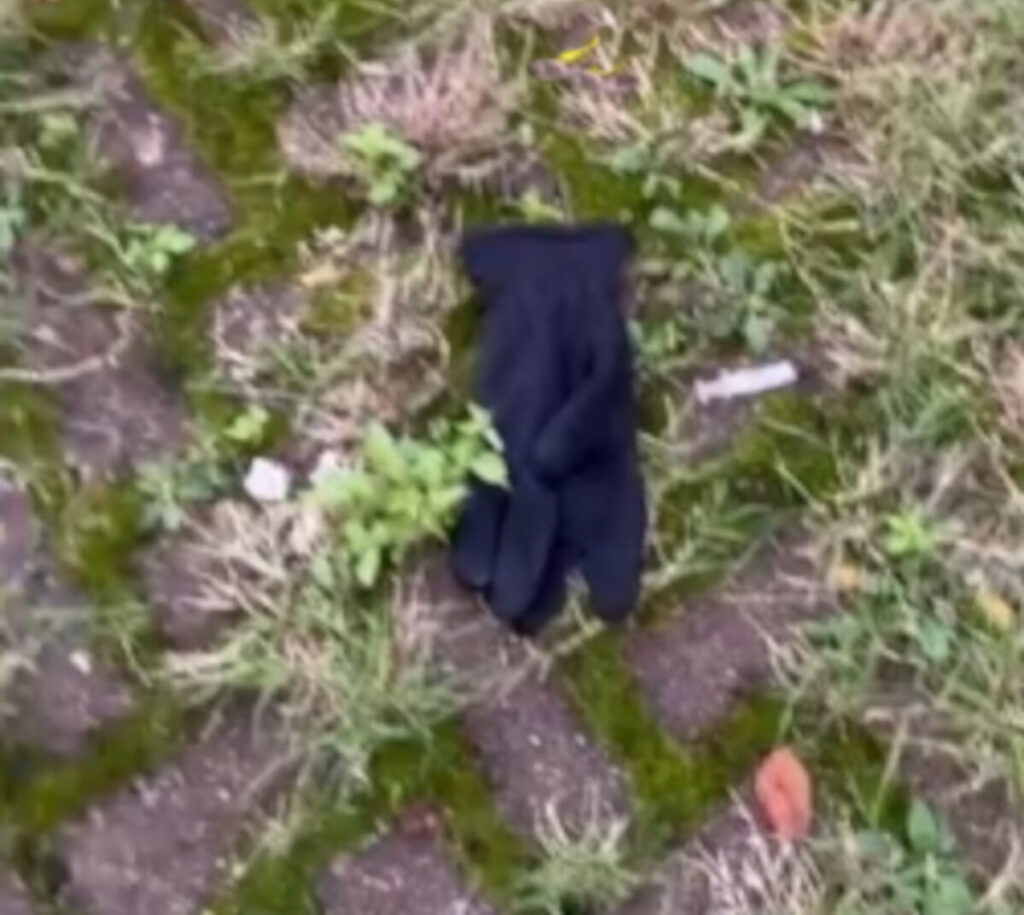 A glove lays next to a discarded needle