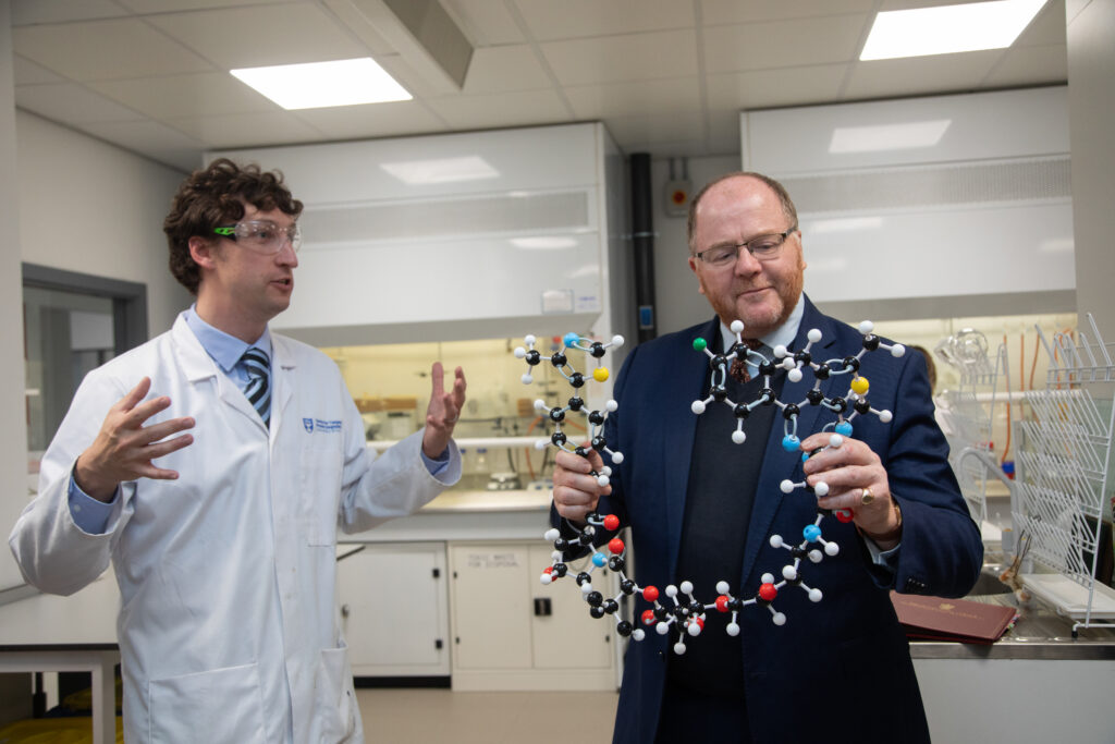 Minister Freeman touring the labs at CeTPD. Pictured holding a molecule structure model