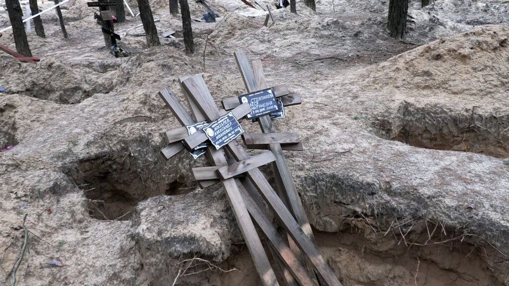 Izium mass grave crosses.