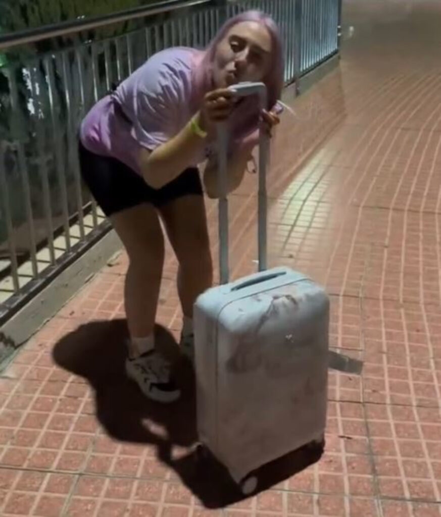 Yasmine with her suitcase.