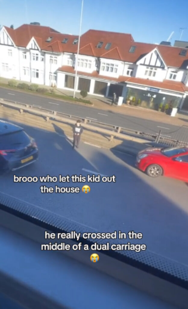 The video shows the youngsters daring dash across the busy road.