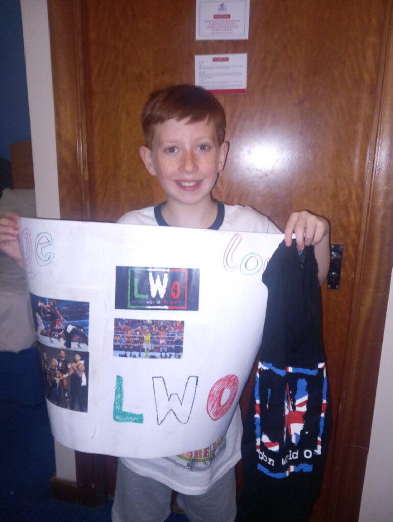 Callan with his sign and the vest