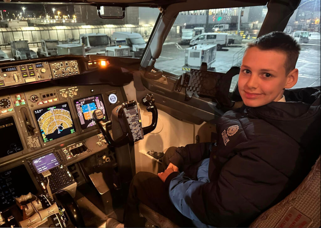 Kaiden, 13, in the cockpit of the plane.