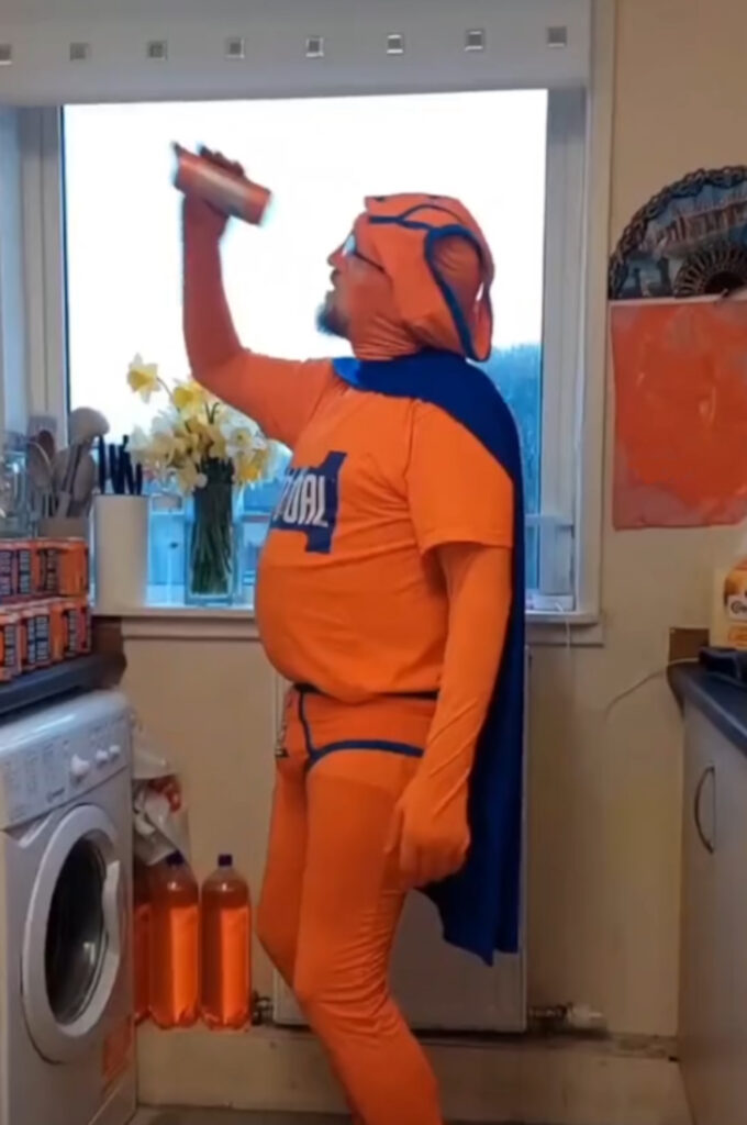 The Irn Bru crazed Scot dresses as a superhero to entertain fans.