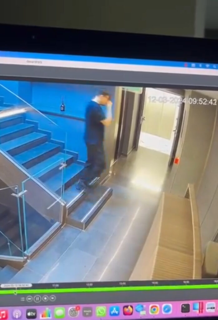 WATCH the moment a bloke trips down the stairs and inadvertently sets off the fire alarm for the entire building.