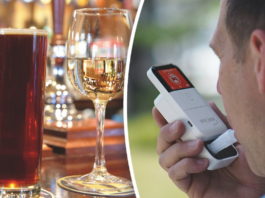 A glass of beer and wine alongside someone taking a breathalsyer test.