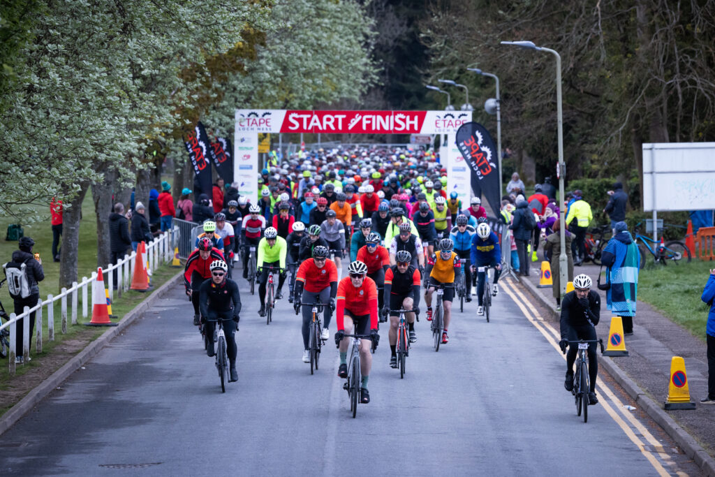 Cyclists set off from the starting line in Inverness led by Brian Smith