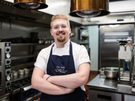 Jack Coghill stands arms folded in his kitchen (image supplied with release by Advantage PR)