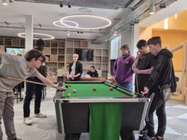 Group of youth playing pool at the Y Centre.