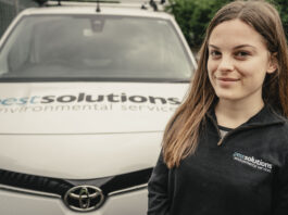 Masie Bullock stands next to a Pest Solutions van. Image supplied with release by Spreng Thomson
